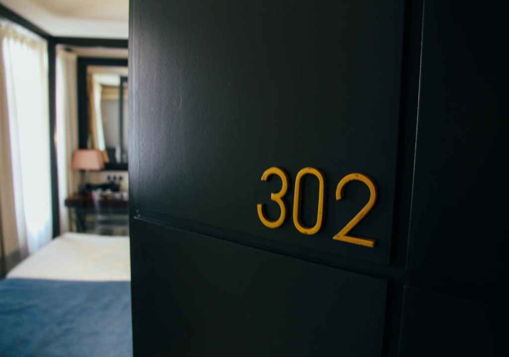 Open door displaying numbers 302