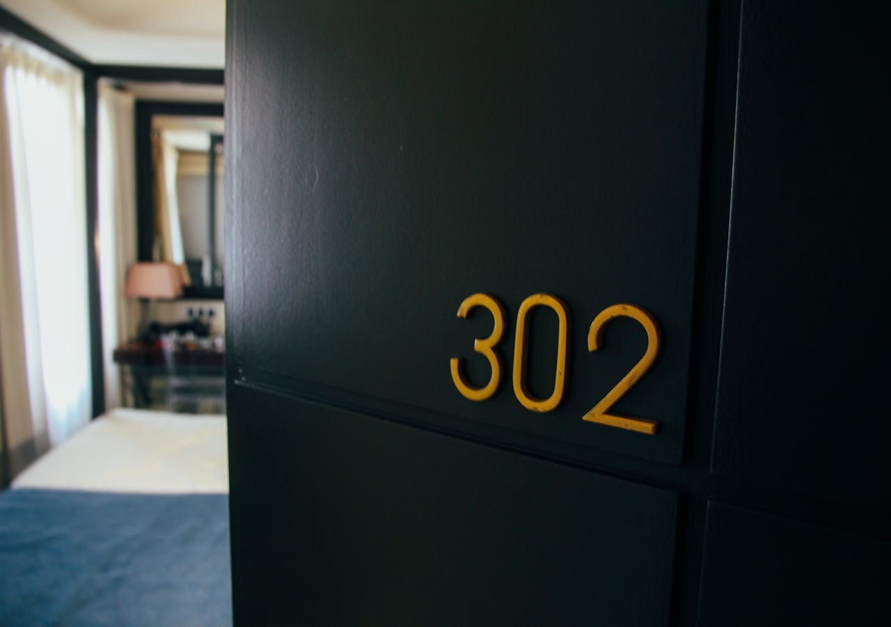 Open door displaying numbers 302