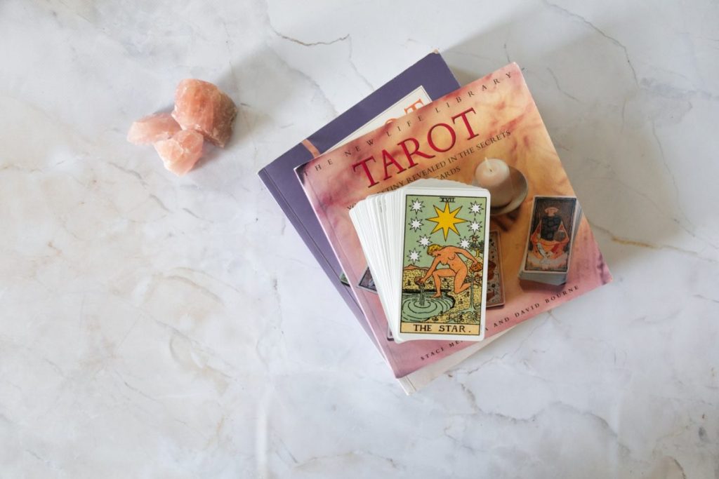 tarot deck on a table with crystals