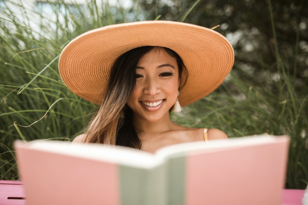 smiling woman reading a book