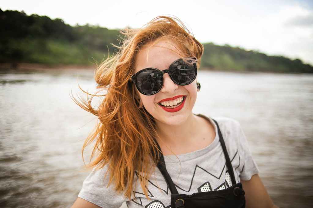 smiling woman in sunglasses