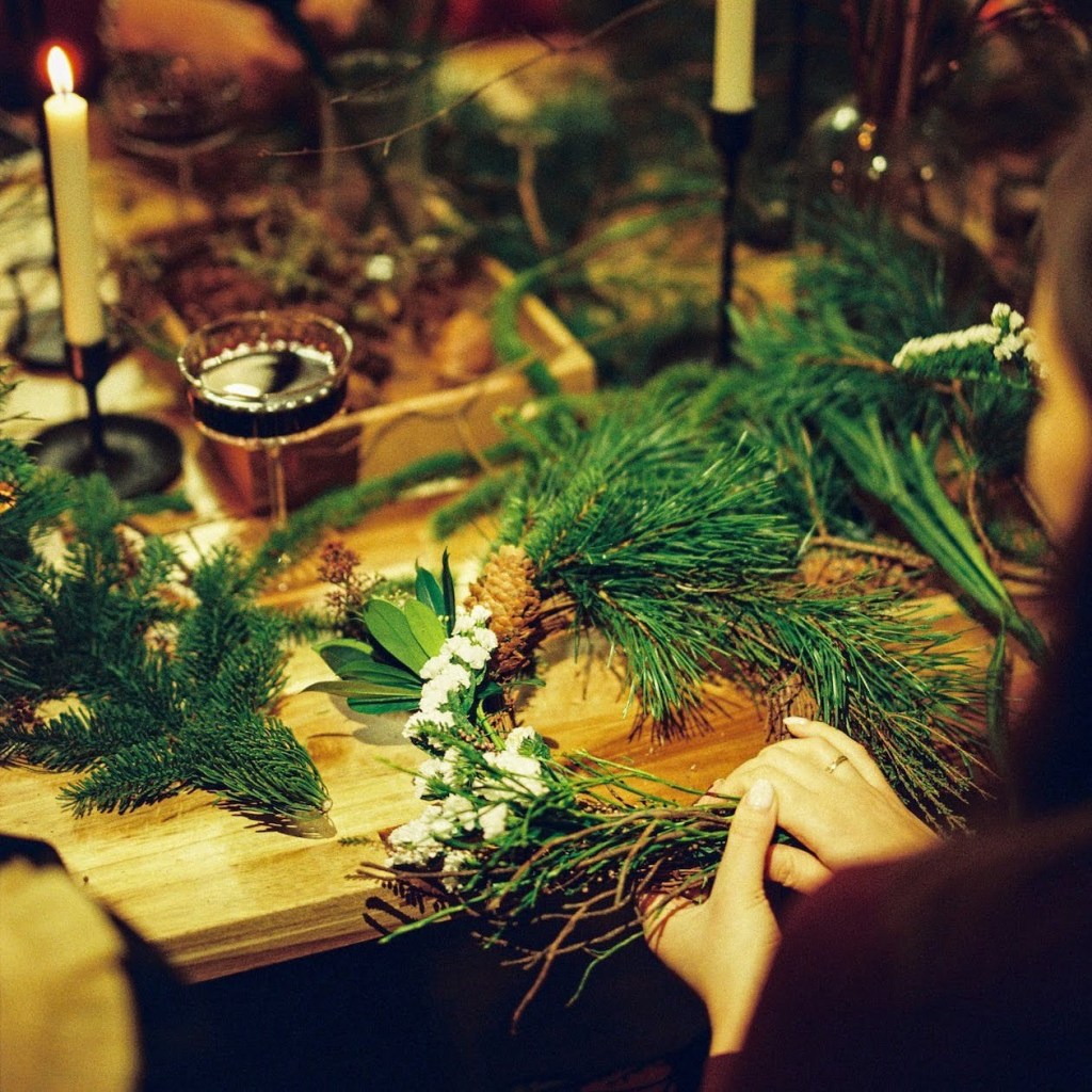 woman making a wreath